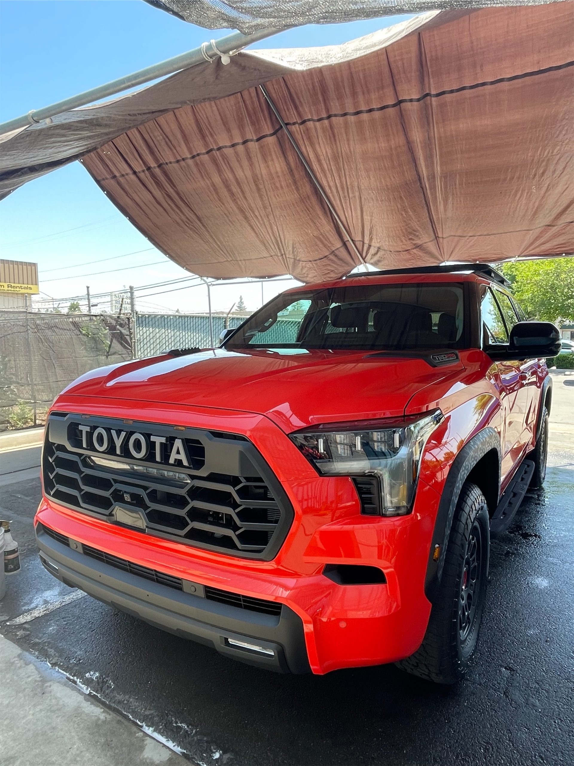 Front view of a modern SUV showing a high-gloss finish after a paint protection service.