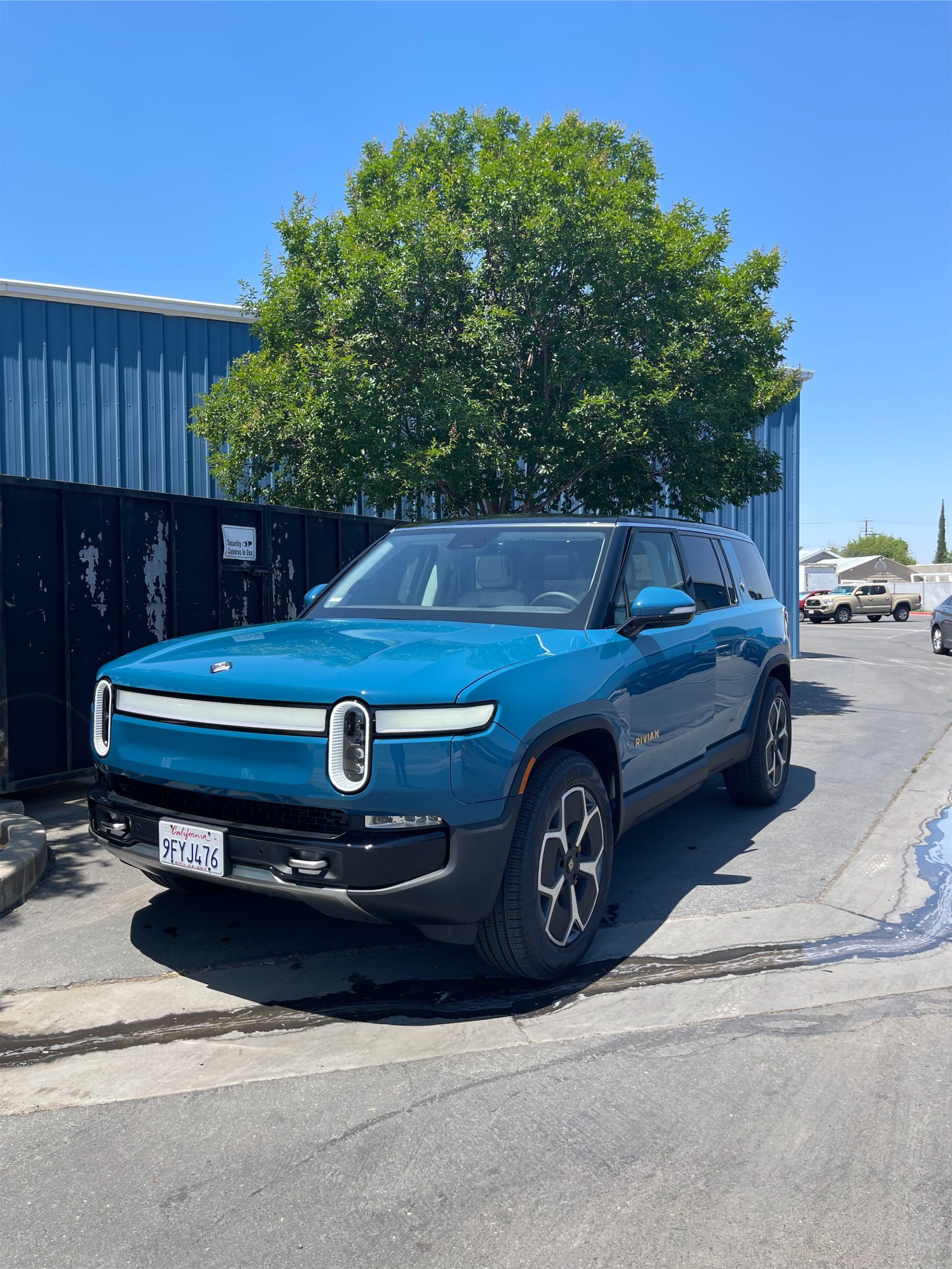 Side profile of a performance sports car with a pristine, mirror-like paint finish.